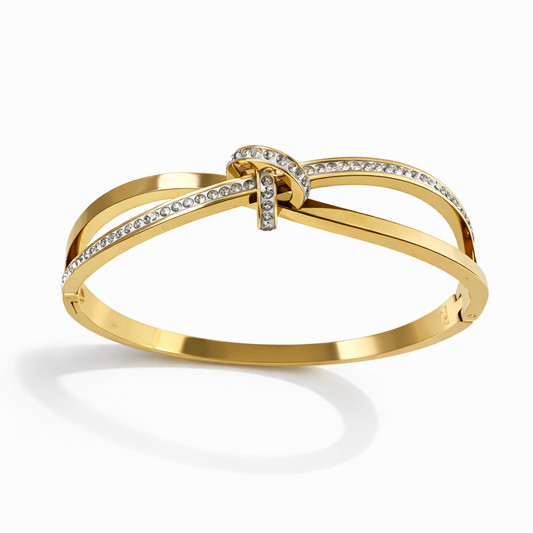 Bracelet jonc en acier inoxydable doré – Nœud strass élégant